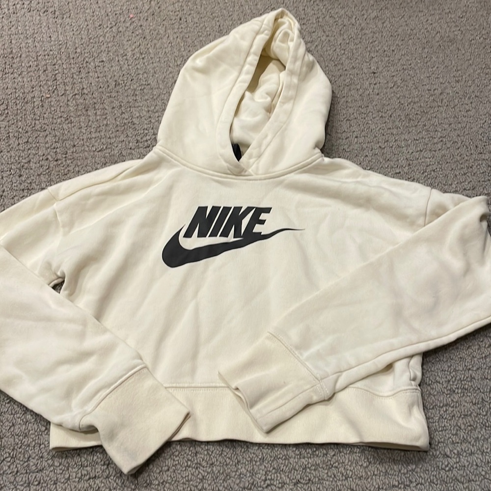 Cream colored large cropped sweater with a hood
